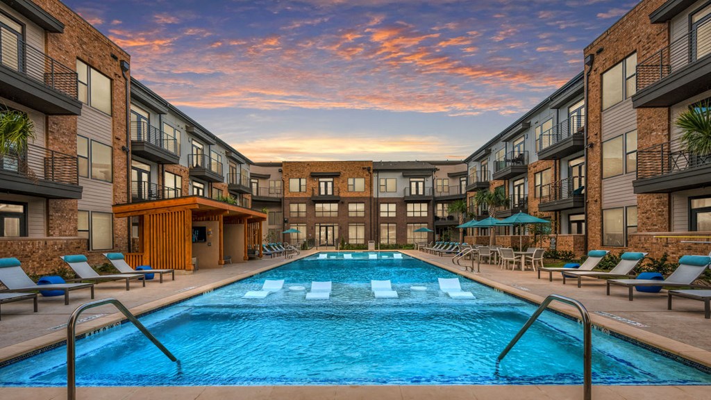 a swimming pool in the middle of an apartment building