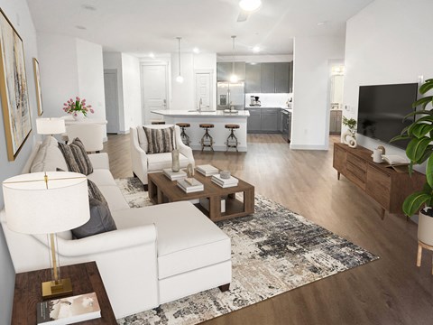 A modern living room with a white sofa and a coffee table.