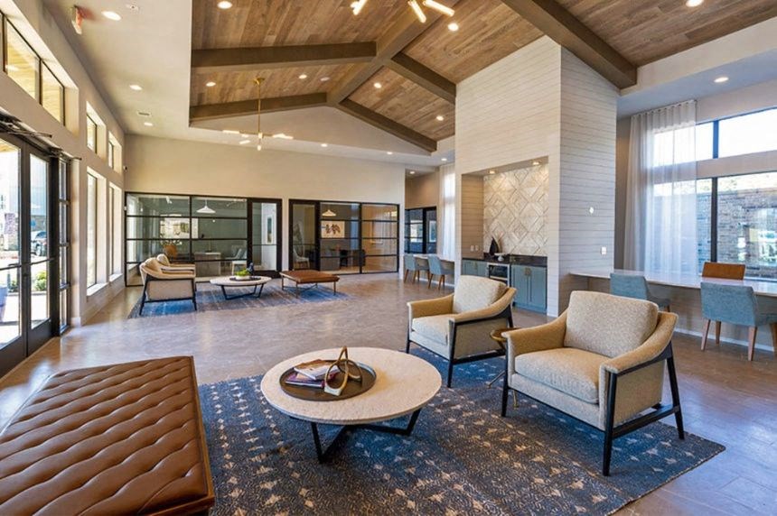 a large lobby with chairs and a coffee table