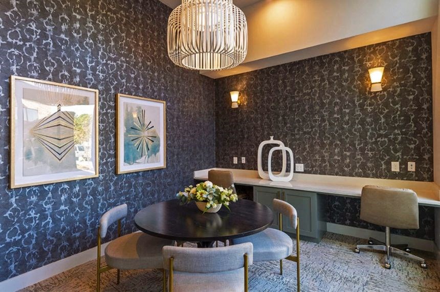 a dining room with a table and chairs