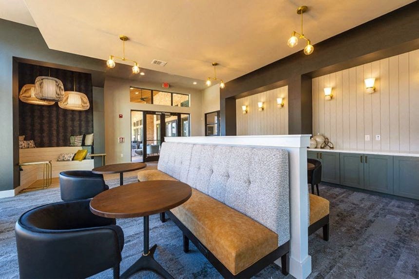 a living room with a couch and tables