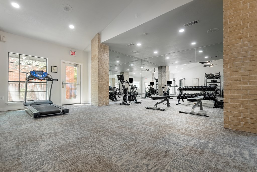 a workout room with weights and cardio equipment at the preserve at greatstone