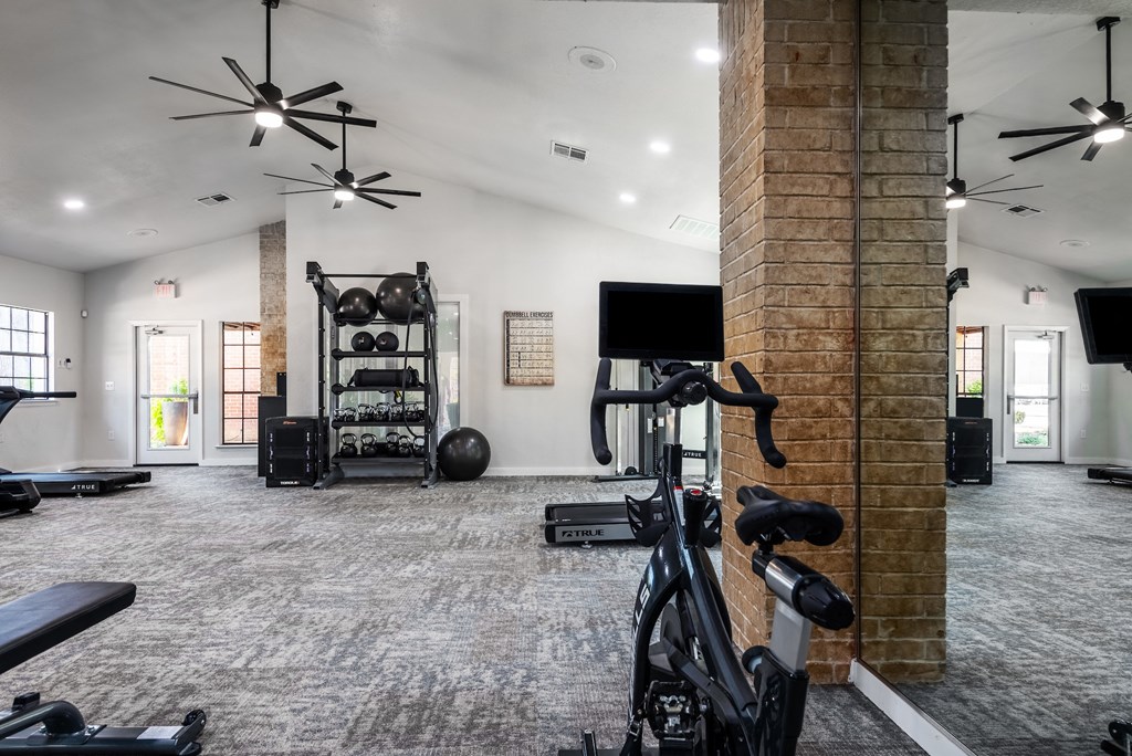the gym at the flats at big tex apartments