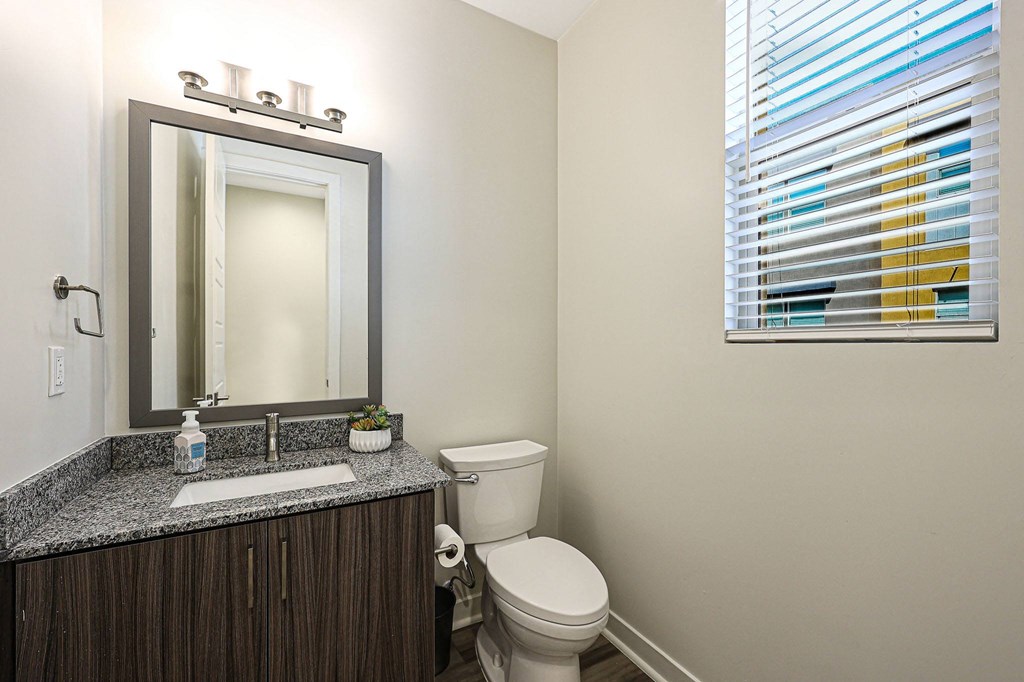 a bathroom with a toilet sink and mirror at Scottsdale Hayden Townhomes, Arizona, 85257