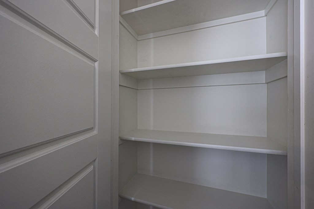 a close up of the built in shelving in the walk in closet at Scottsdale Hayden Townhomes, Scottsdale, Arizona