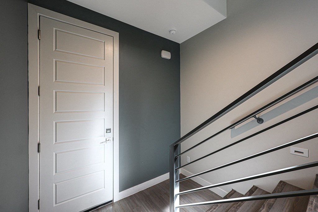 a bedroom with a bed and a door at Scottsdale Hayden Townhomes, Scottsdale, AZ, 85257