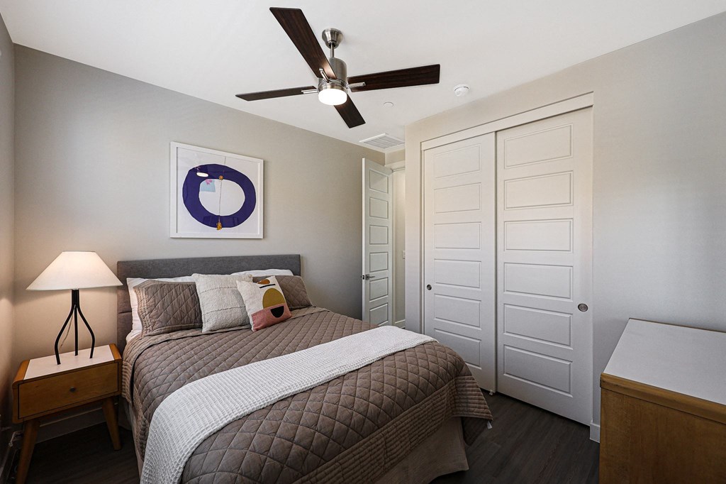 a bedroom with a bed and a ceiling fan  at Scottsdale Hayden Townhomes, Scottsdale, 85257