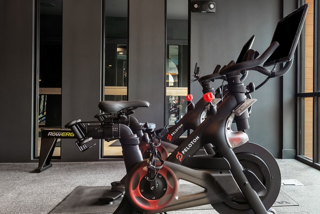 A stationary bike is parked in a room.