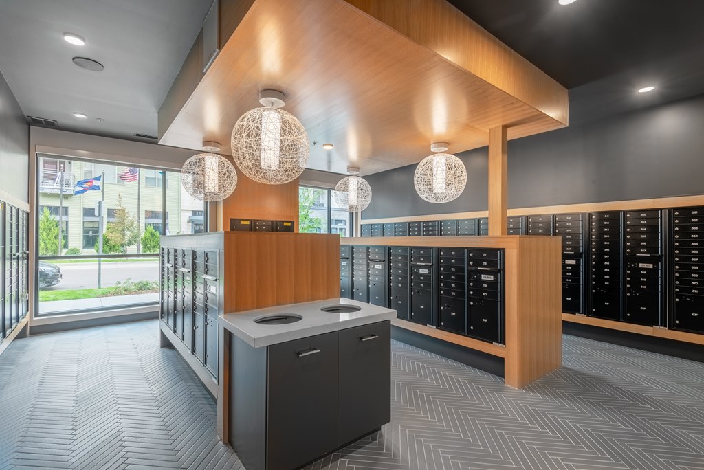 A reception area with a counter and a row of lockers.