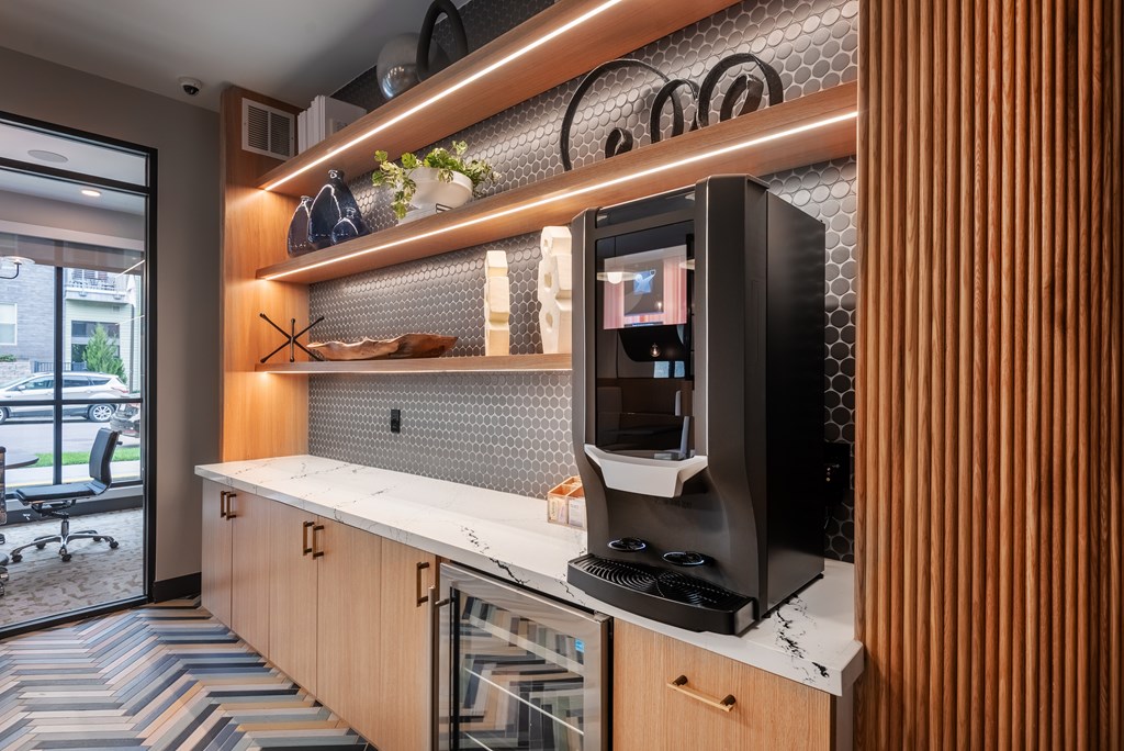 A modern kitchen with a countertop and a microwave.