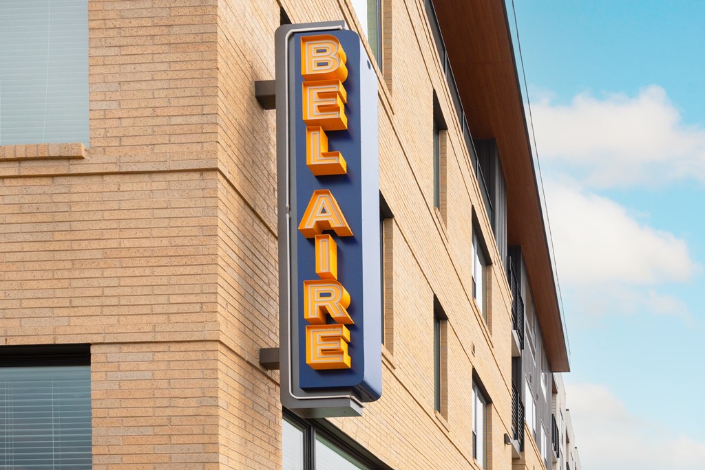 A sign that says Bel Air is mounted on a building.