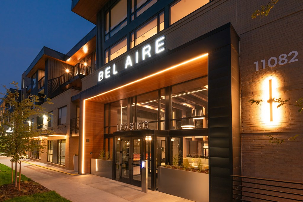 The Bel Air leasing building is well lit up at night.