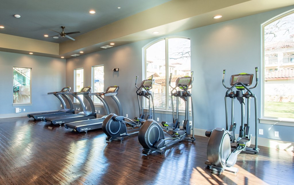 exercise equipment at mela's luxury apartments in san antonio