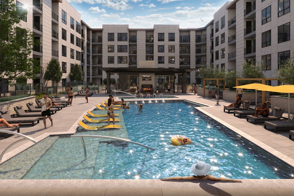 A large swimming pool in a courtyard surrounded by buildings.