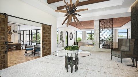 A modern living room with a large circular table and a wooden ceiling fan.