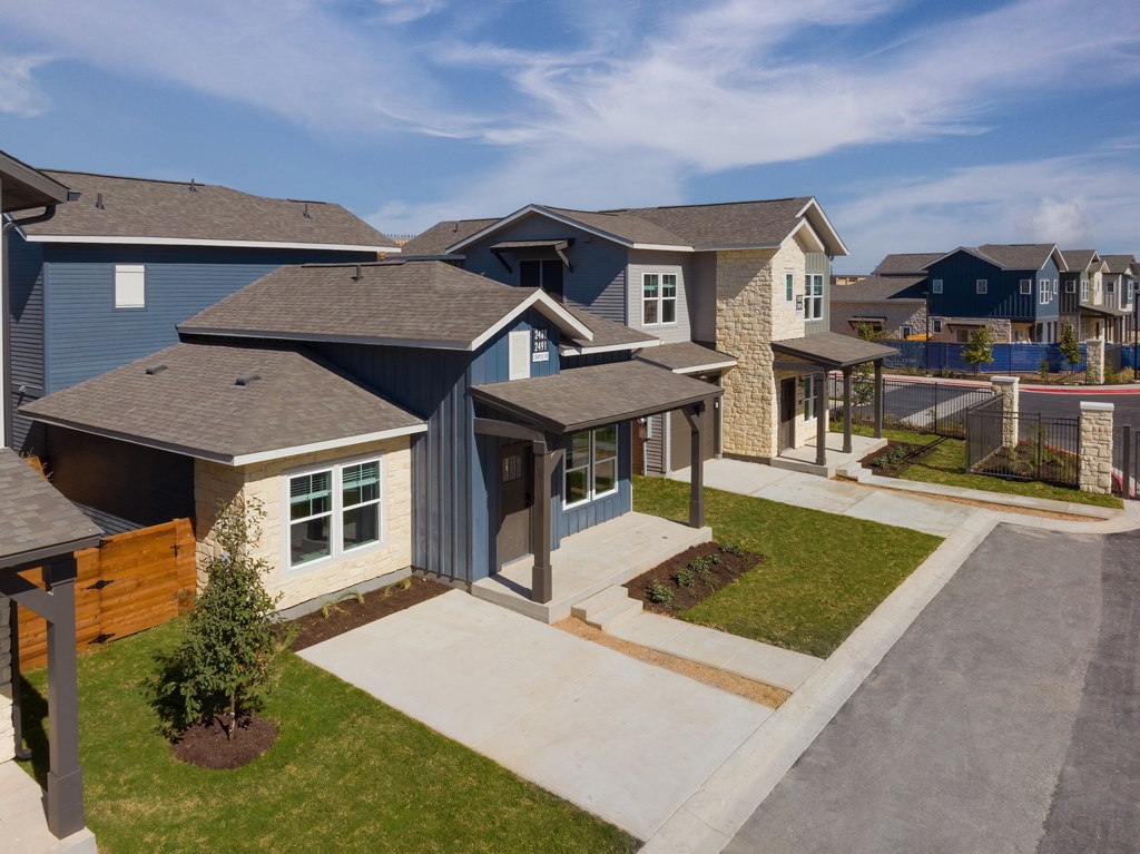 a group of homes in a row on a street