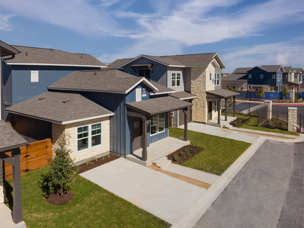 a group of homes in a row on a street