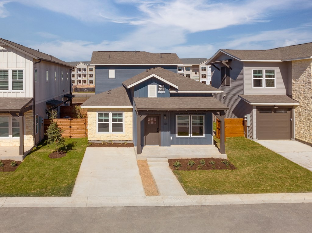 a house with a sidewalk in front of it