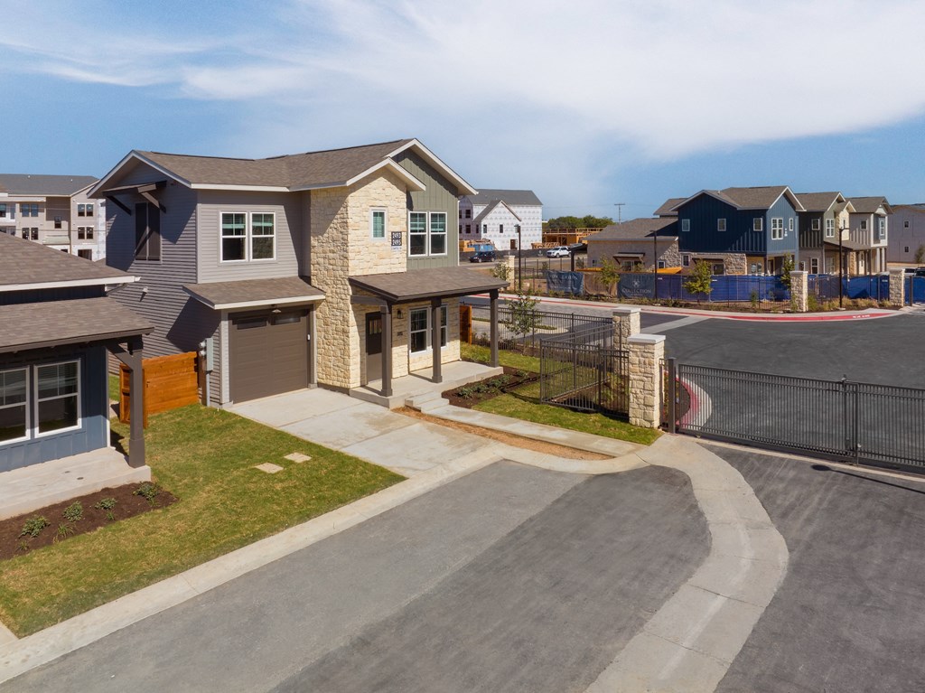 a row of houses on the side of a street