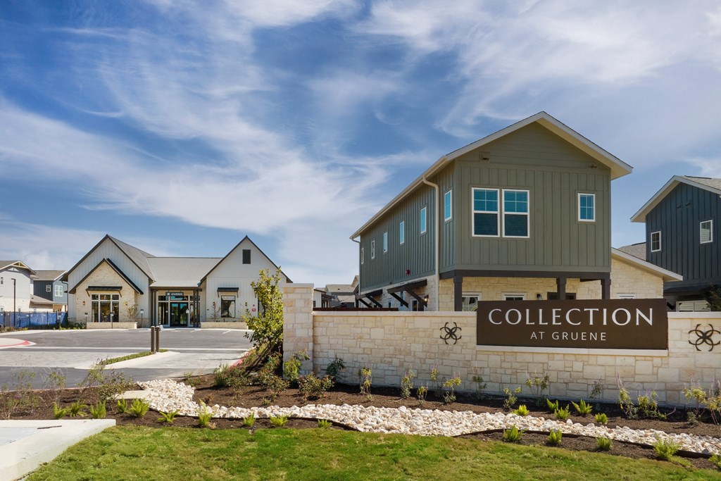 a sign for the collection at grange in front of a building