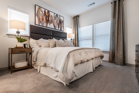 the preserve at ballantyne commons bedroom with large bed and windows