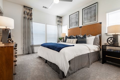 the preserve at ballantyne commons bedroom with large bed and windows