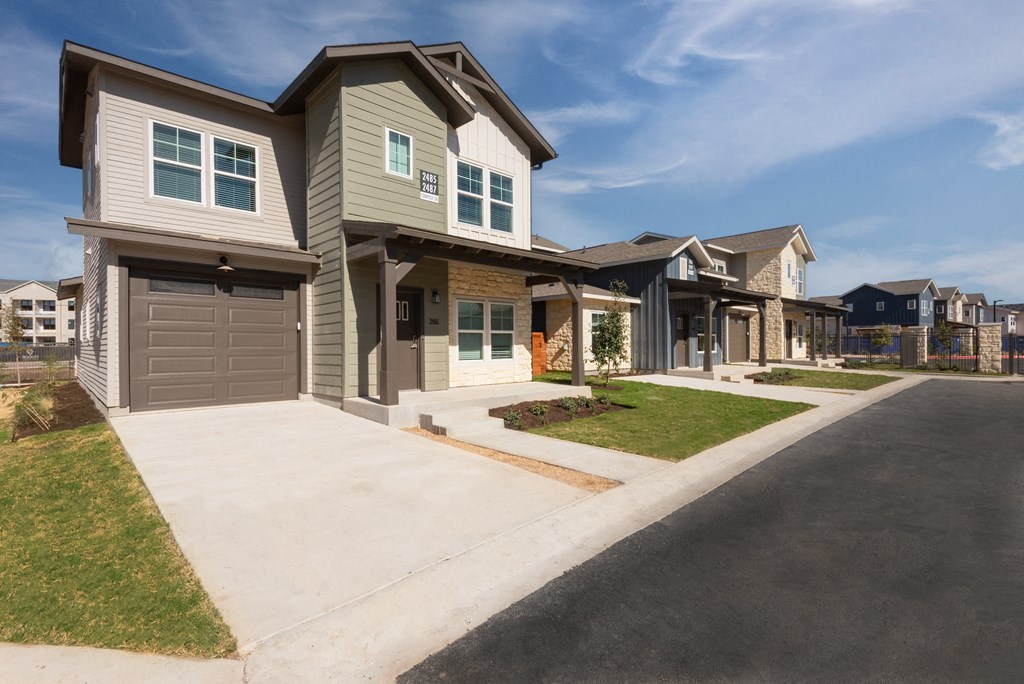 a house with a driveway and a street in front of it