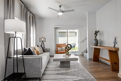 a living room with a gray couch and a coffee table