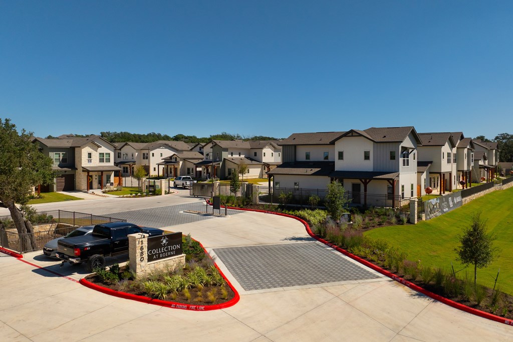 A residential area with houses and a sign that says "COLLECTION".