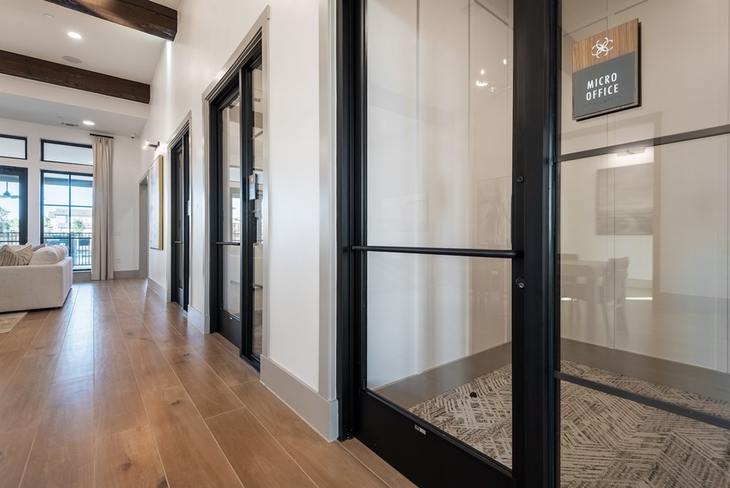 A glass door with a sign that says "Micro Office" on it.