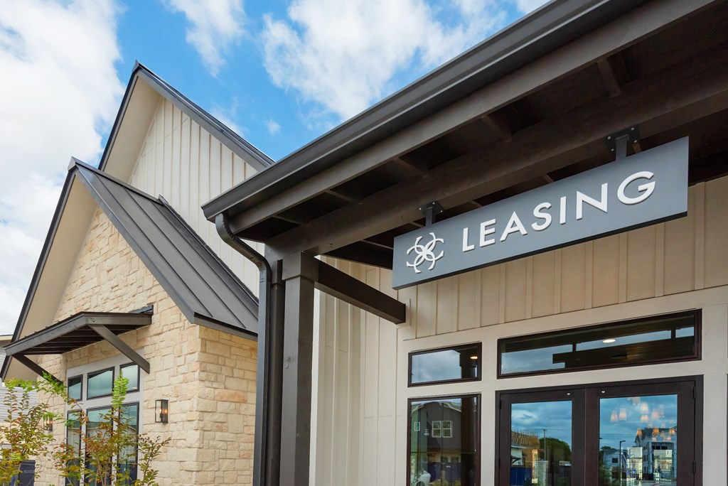 a leasing sign on the front of a building