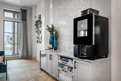 a living room with a television on a counter and a window