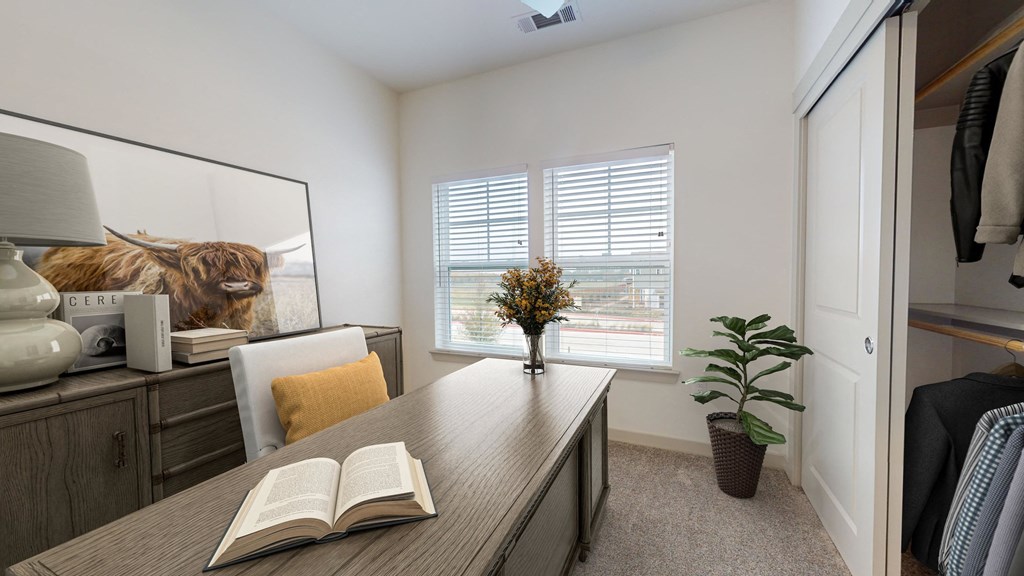 a home office with a desk and a book on it