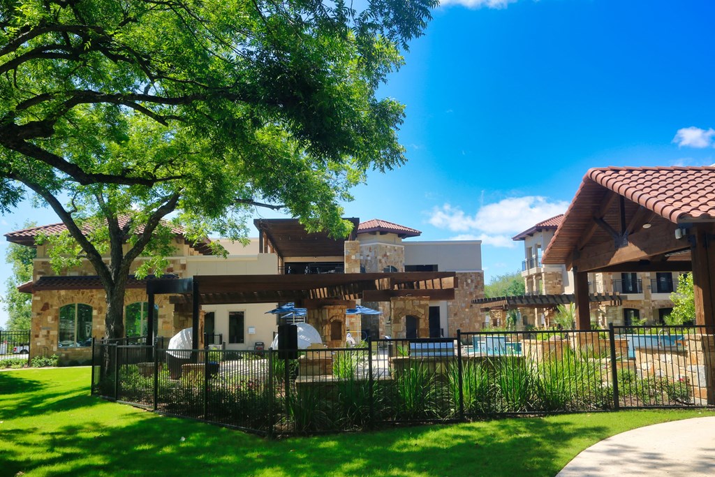 a large building with a pool in front of it