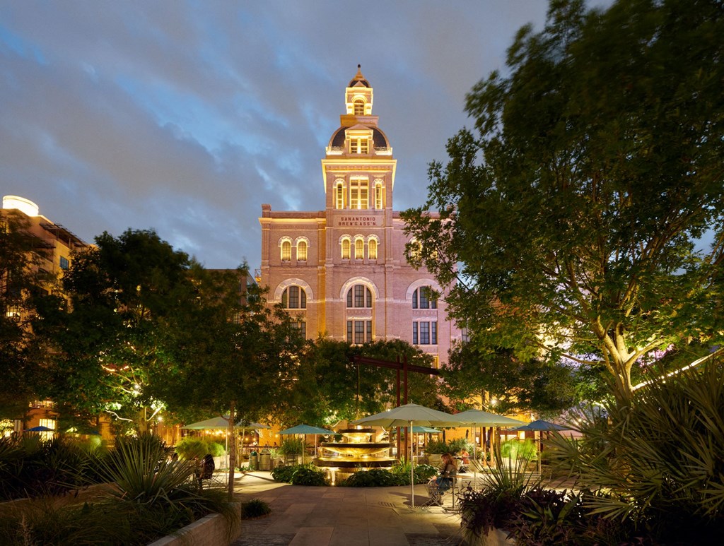 a tall building with a clock tower at night