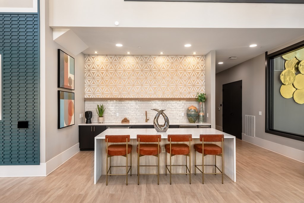 Clubhouse lounge with island seating and kitchenette at Finley on the Green.
