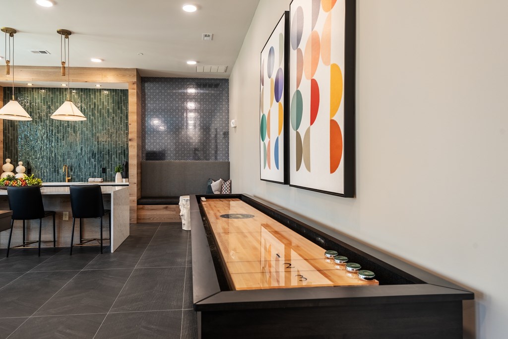 A modern kitchen with a dining table and chairs.