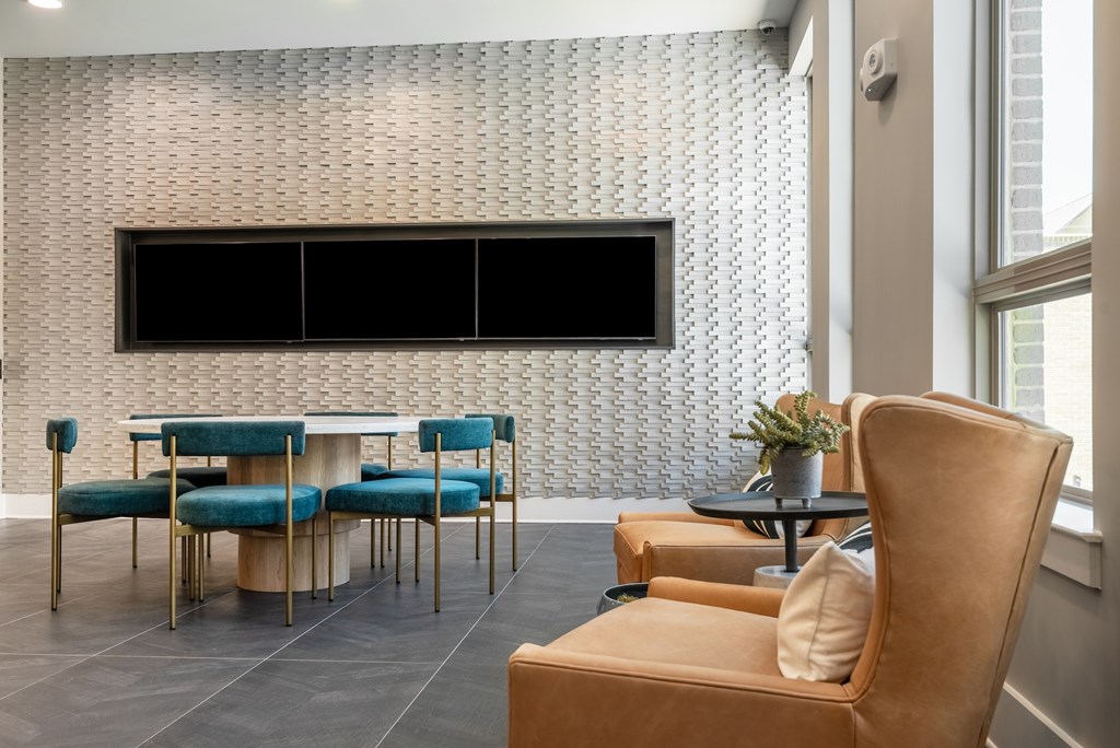 A modern living room with a blue and gold sofa set.
