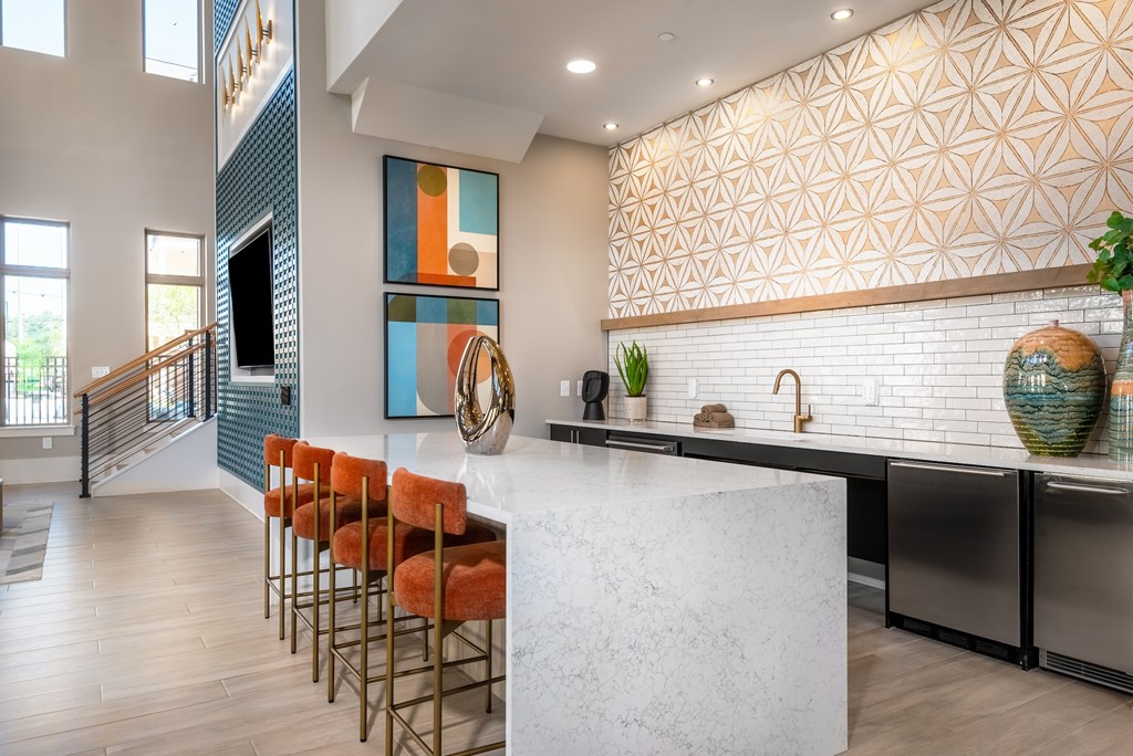 Community lounge with bar seating and modern design at Finley on the Green.