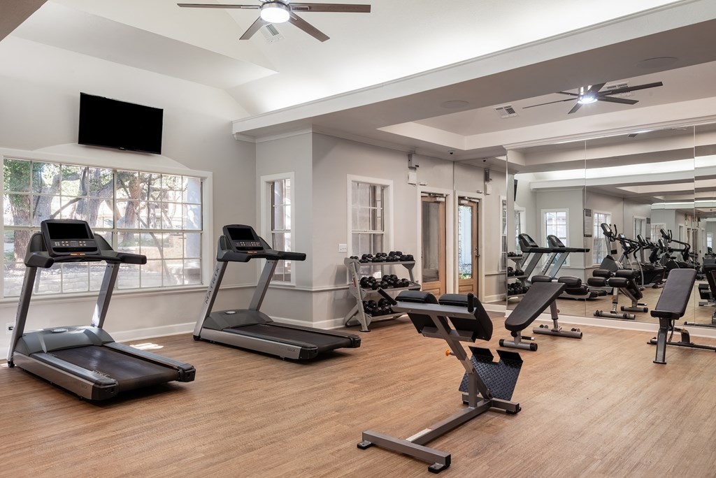 a fitness room with treadmills and other exercise equipment  at Hayden on West Ave, San Antonio, Texas