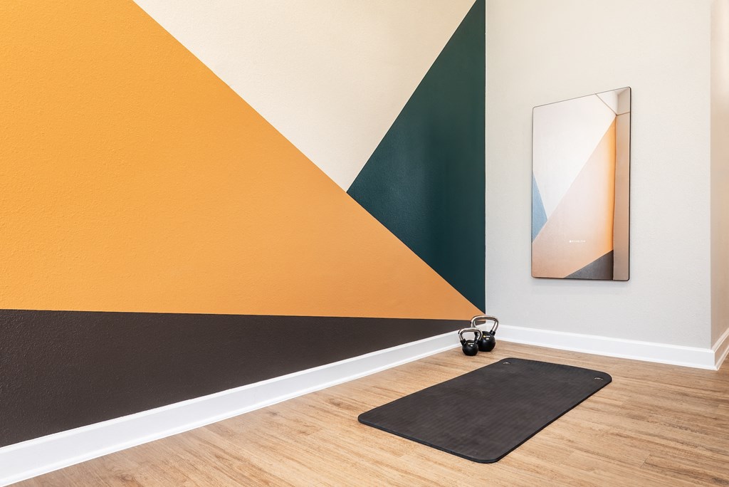 a black rug and a mirror on a wall in a room  at Hayden on West Ave, San Antonio, TX