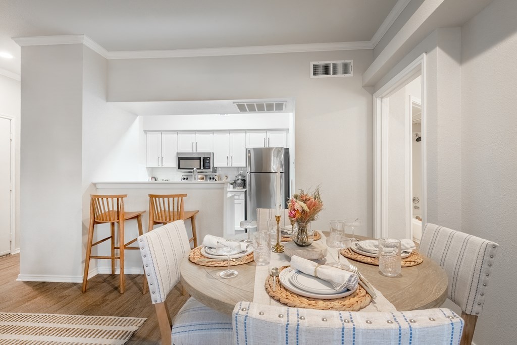 a dining room and kitchen with a table and chairs  at Hayden on West Ave, San Antonio, Texas