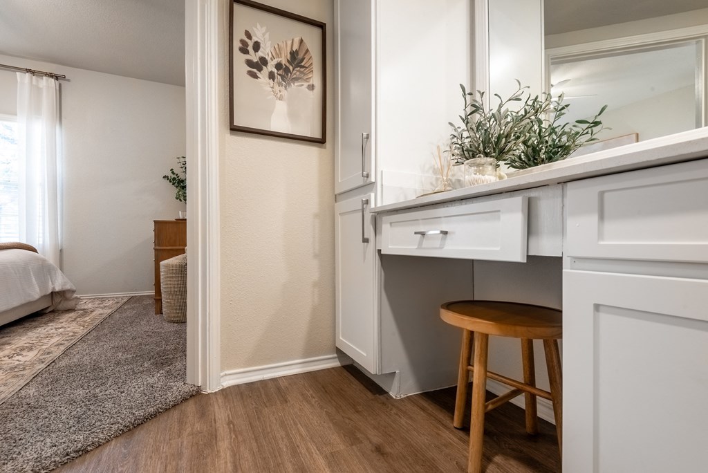 a living room with a desk and a door to a bedroom  at Hayden on West Ave, San Antonio, Texas