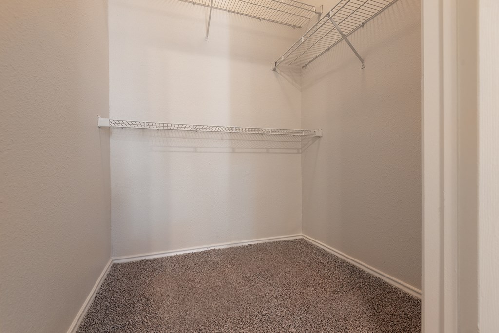 a empty room with a carpeted floor and a white closet  at Hayden on West Ave, San Antonio, TX, 78216