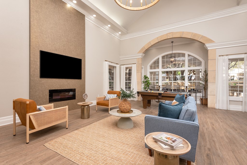 a living room with a fireplace and a table with chairs  at Hayden on West Ave, San Antonio