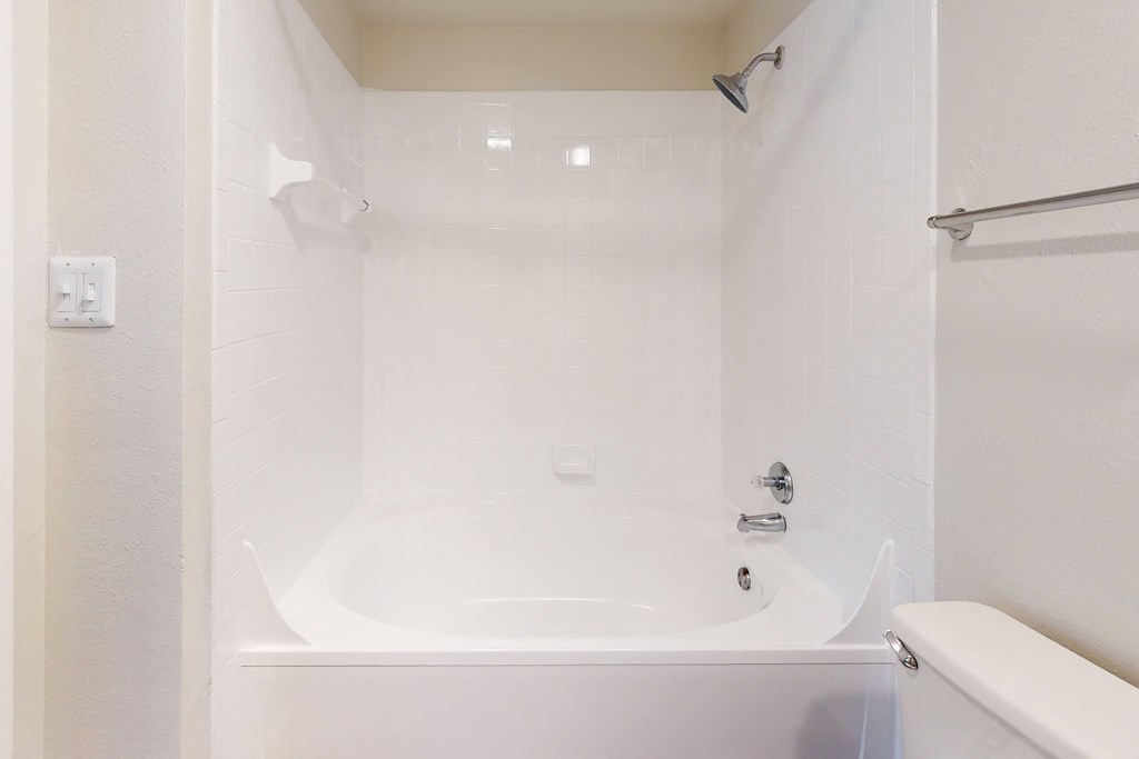 a bathroom with a bathtub and shower  at Hayden on West Ave, San Antonio, TX, 78216
