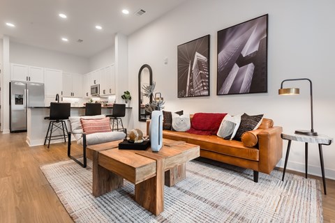 A modern living room with a wooden coffee table and a couch.