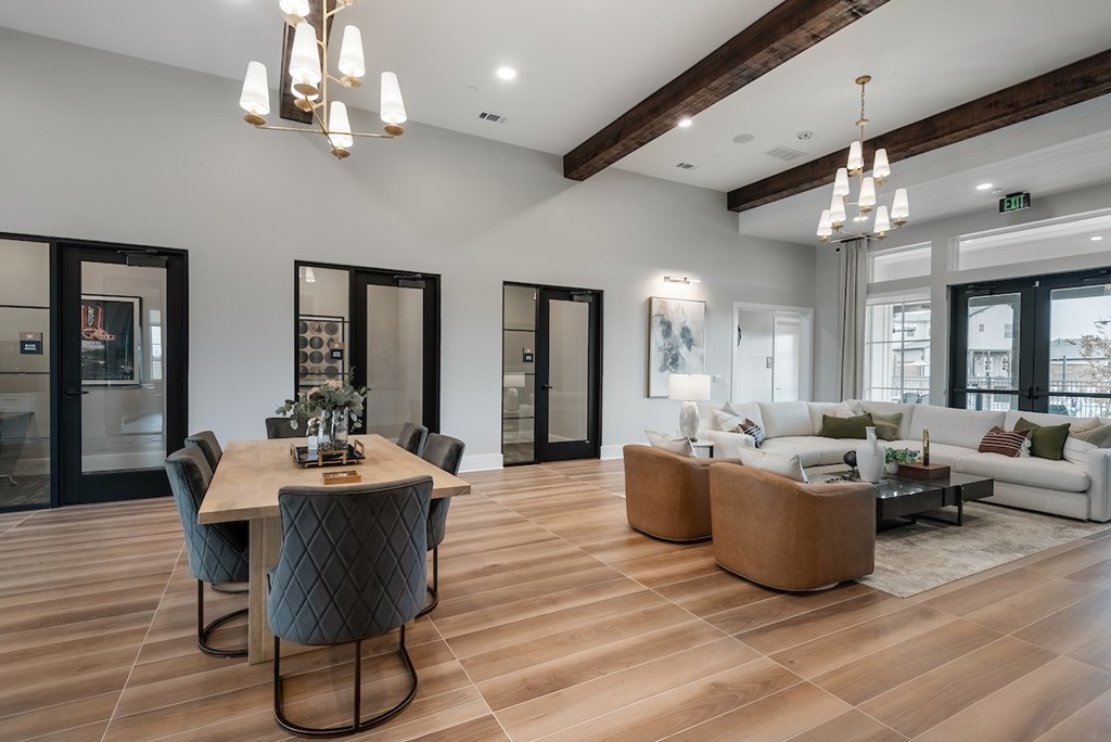 A modern living room with a dining table and a couch.