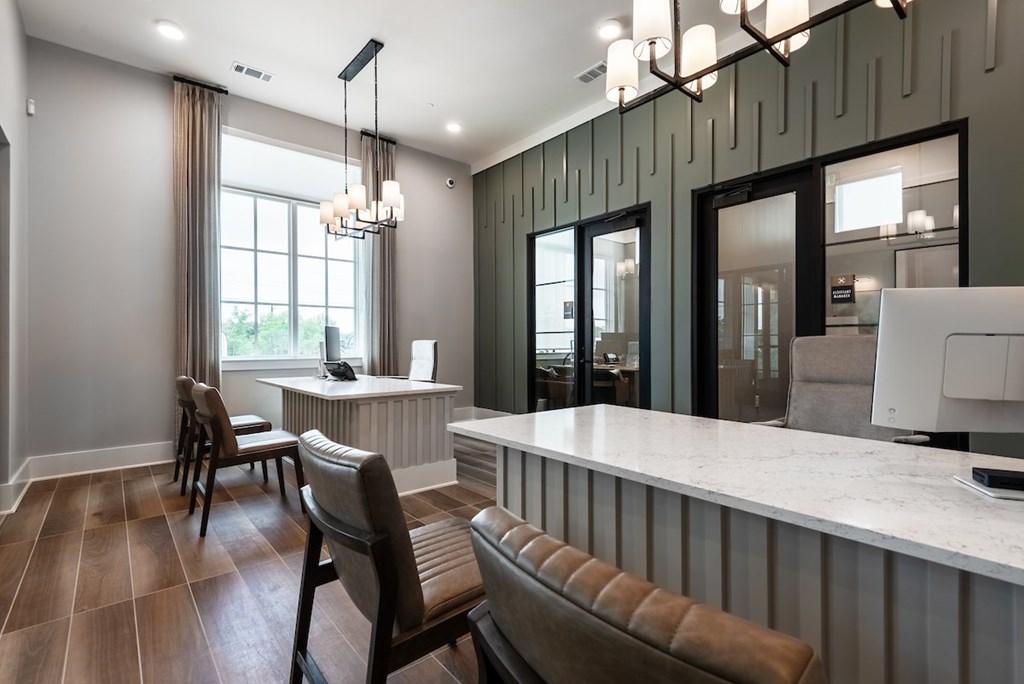 A modern kitchen with a bar area and a dining table.