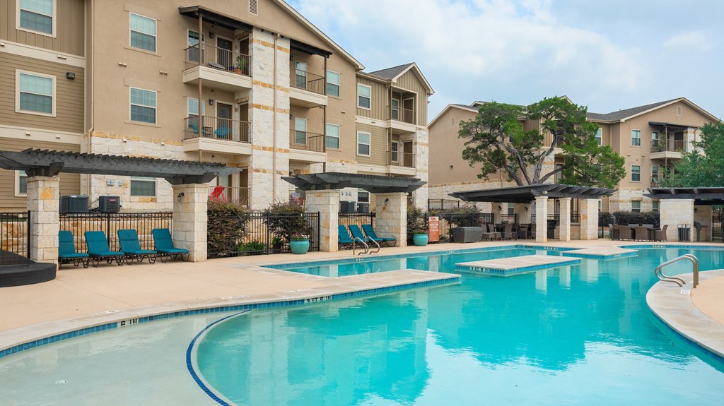 our apartments have a large swimming pool with chairs